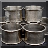K31. Set of 7 hammered metal napkin rings - $20 